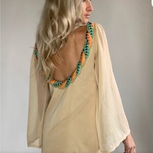 Judith March Cream Backless Dress with Orange and Green Trim and scoop neck.